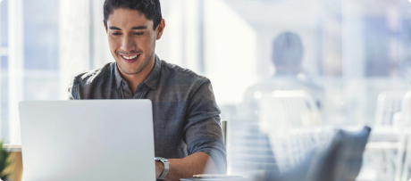 payroll manager checking data on his laptop with the help of myob advanced payroll