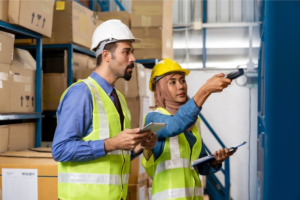 Inventory manager and staff checking stock counts on mobile 